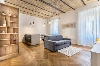 a living room with a couch and a table at SanGiò - Appartamento San Giovanni in Rome