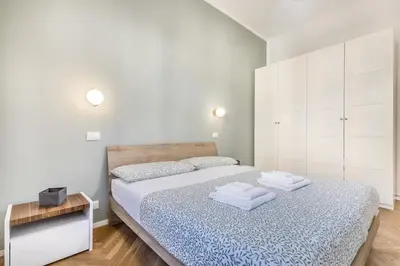 a bedroom with a bed with two towels on it at SanGiò - Appartamento San Giovanni in Rome