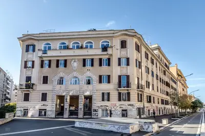 a building on the corner of a street at SanGiò - Appartamento San Giovanni in Rome