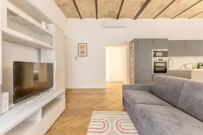 a living room with a couch and a television at SanGiò - Appartamento San Giovanni in Rome
