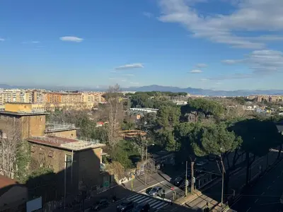 an overhead view of a city with buildings and trees at Stylish & Trendy Hub in Rome in Rome