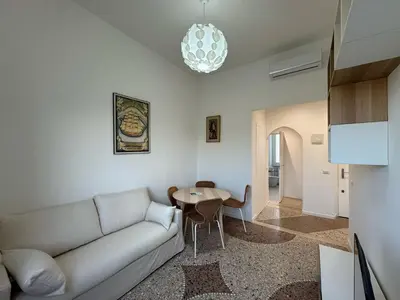a living room with a couch and a table at Stylish & Trendy Hub in Rome in Rome