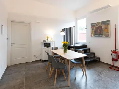a dining room with a table and chairs at BNB Ostiense in Rome