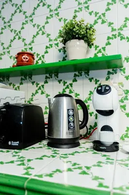 a kitchen counter with a coffee maker and a toaster at ZENO 13 Paradiso - Casa Verde in Rome