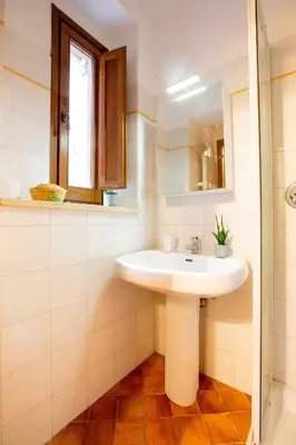 a bathroom with a sink and a mirror at ZENO 13 Paradiso - Casa Verde in Rome