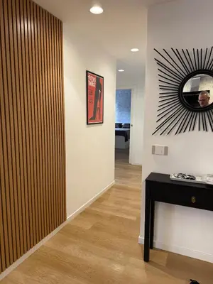 a room with a wall with a tv on a wall at Appartamento in Rome