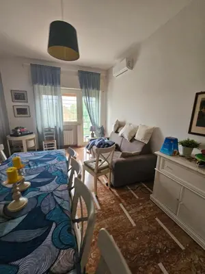 a living room with a couch and a table at CS Banco Apartment in Rome