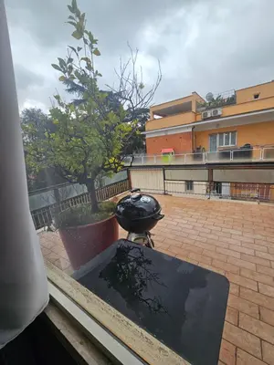 a grill sitting on top of a patio at CS Banchetto Apt 2 pax in Rome