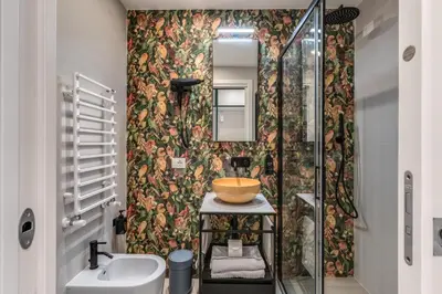 a bathroom with a sink and a mirror at Relais Marco Polo in Rome