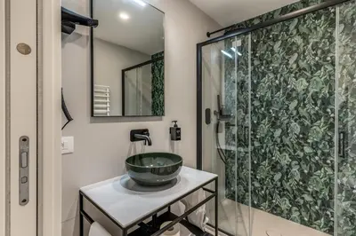 a bathroom with a sink and a shower at Relais Marco Polo in Rome