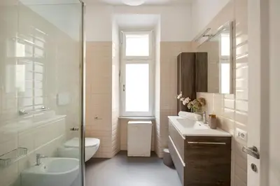 a bathroom with a sink and a toilet and a shower at Bordeaux luxury apartment Rome in Rome