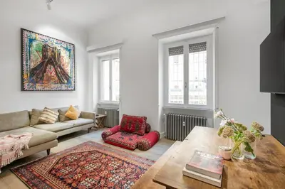 a living room with a couch and a table at Bordeaux luxury apartment Rome in Rome
