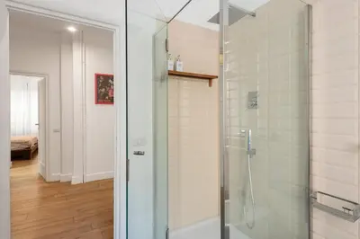 a bathroom with a shower with a glass door at Bordeaux luxury apartment Rome in Rome