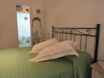 a bedroom with a bed with two pillows on it at Casa Francesca in Rome