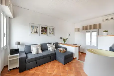 a living room with a couch and a table at Menta luxury apartment Rome in Rome