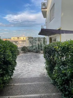 a balcony of a building with a walkway at Welcome to Retreat in Trastevere in Rome