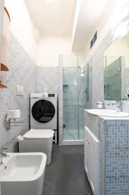a bathroom with a toilet and a sink and a shower at Butterfly House Ponte Milvio in Rome