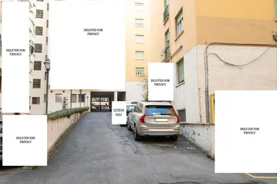 a car parked in a parking lot next to buildings at Butterfly House Ponte Milvio in Rome