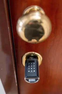 a door with a cell phone in a door knob at Butterfly House Ponte Milvio in Rome