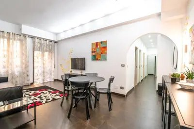 a dining room with a table and chairs at Butterfly House Ponte Milvio in Rome