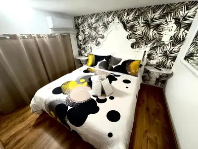 a bedroom with a black and white cow bed at Machiavelli House in Rome