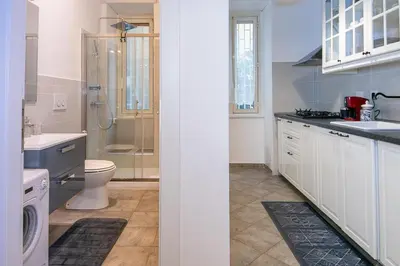 a bathroom with a shower and a toilet and a sink at Rhome311 - Vatican Apartment in Rome