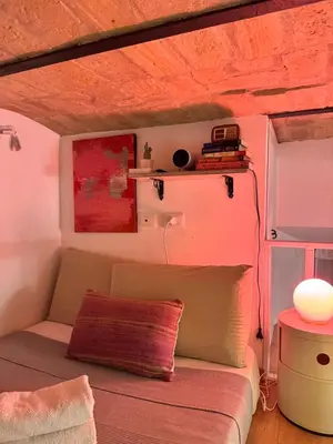 a living room with a couch and a table at Bright and cosy appartament near the city center in Rome