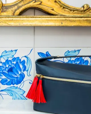 a blue purse with a red tassel at Luxury house Empire 96 in Rome