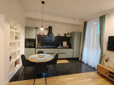 a kitchen and dining room with a table and chairs at Bellissimo bilocale al centro di Roma - Daniele Case Vacanza in Rome