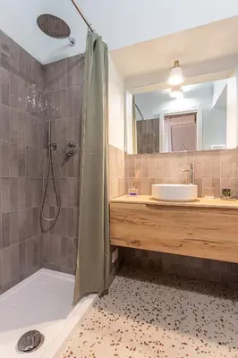 a bathroom with a shower and a sink at Ambra - Liberty Apartment at the Imperial Forums in Rome