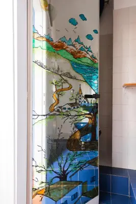 a shower door with a painting on the wall at Grande appartamento a Trastevere in Rome