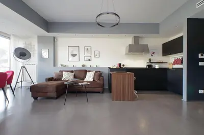 a living room with a couch and a kitchen at YCH-Exclusive apartment on Circus Maximus in Rome