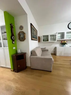 a living room with a couch and a table at Casa Conca D Oro in Rome