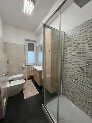 a bathroom with a shower and a tub and a sink at Casa Conca D Oro in Rome