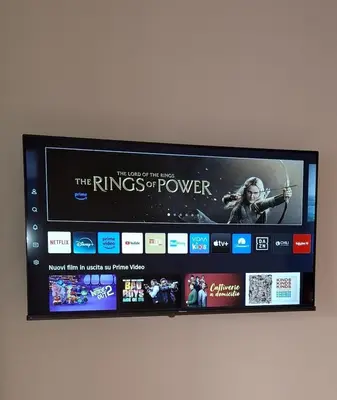 a flat screen tv hanging on a wall at Appartamento Aurelio in Rome