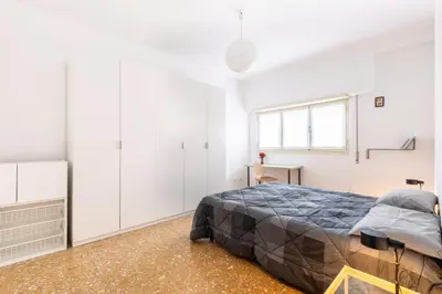 a bedroom with a bed and a window at Grazioso appartamento a Roma San Paolo in Rome
