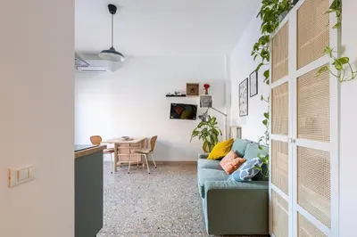 a living room with a couch and a table at Grazioso appartamento a Roma San Paolo in Rome