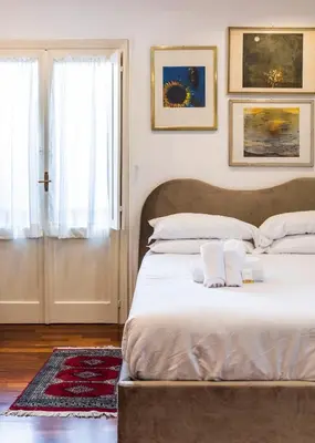 a bedroom with a bed with two towels on it at FCR Rome Apartments Loft Campo de' Fiori - Monserrato in Rome