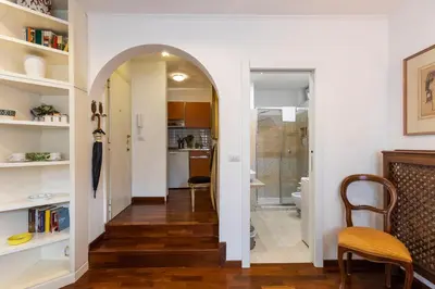 a hallway with an archway leading into a living room at FCR Rome Apartments Loft Campo de' Fiori - Monserrato in Rome