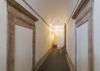 an empty hallway in an old building at FCR Rome Apartments Loft Campo de' Fiori - Monserrato in Rome