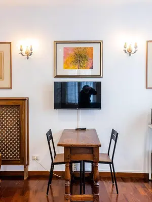 a dining room with a table and a dog on the wall at FCR Rome Apartments Loft Campo de' Fiori - Monserrato in Rome