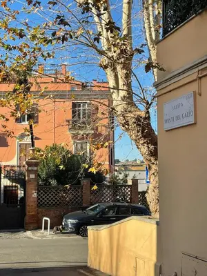 a car parked in front of a building with a sign at Cozy artsy apt near the Vatican in Rome
