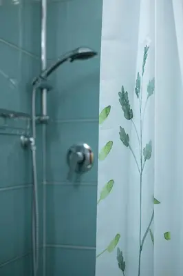 a shower in a bathroom with a glass door at Lorenzo's Rooms in Vatican in Rome