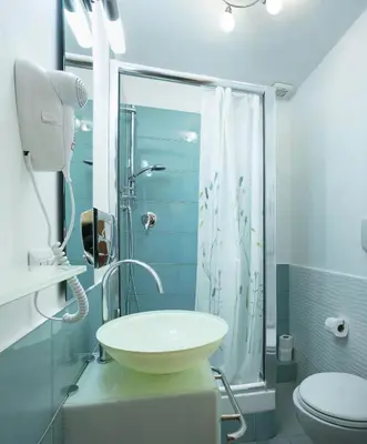 a bathroom with a sink and a shower at Lorenzo's Rooms in Vatican in Rome