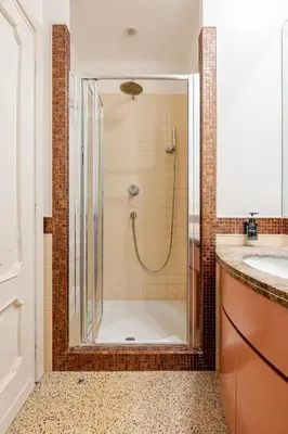 a bathroom with a shower and a sink at Casa Maddalena luxury appartment in Rome