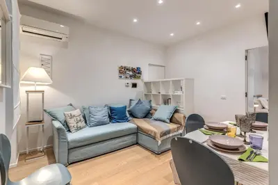 a living room with a couch and a table at Residenza Margherita in Rome