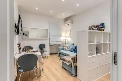 a living room with a table and a couch at Residenza Margherita in Rome