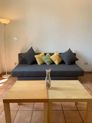 a couch with pillows sitting on top of a table at Flat nearby Vaticano - Caracciolo 4 in Rome