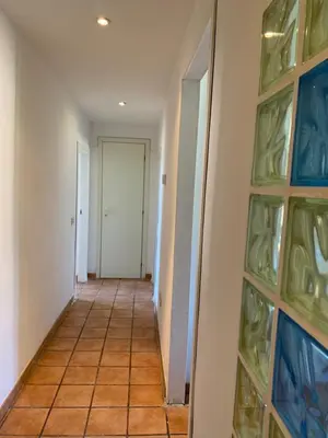 a hallway with a door and some glass shelves at Flat nearby Vaticano - Caracciolo 4 in Rome