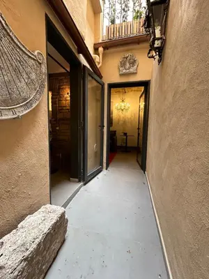 an empty hallway of a building with a balcony at Colosseum loft in Rome